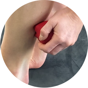 KNUKLBALL massage tool held in hand for precise trigger point therapy and muscle pain relief - ergonomic grip muscle scraping demonstration